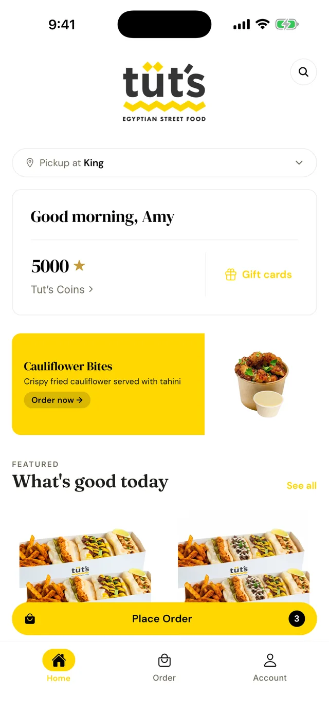 The Tut's Egyptian Street Food app — a real shop's branded iPhone app built on Tany, showing pickup location, loyalty balance and featured menu items